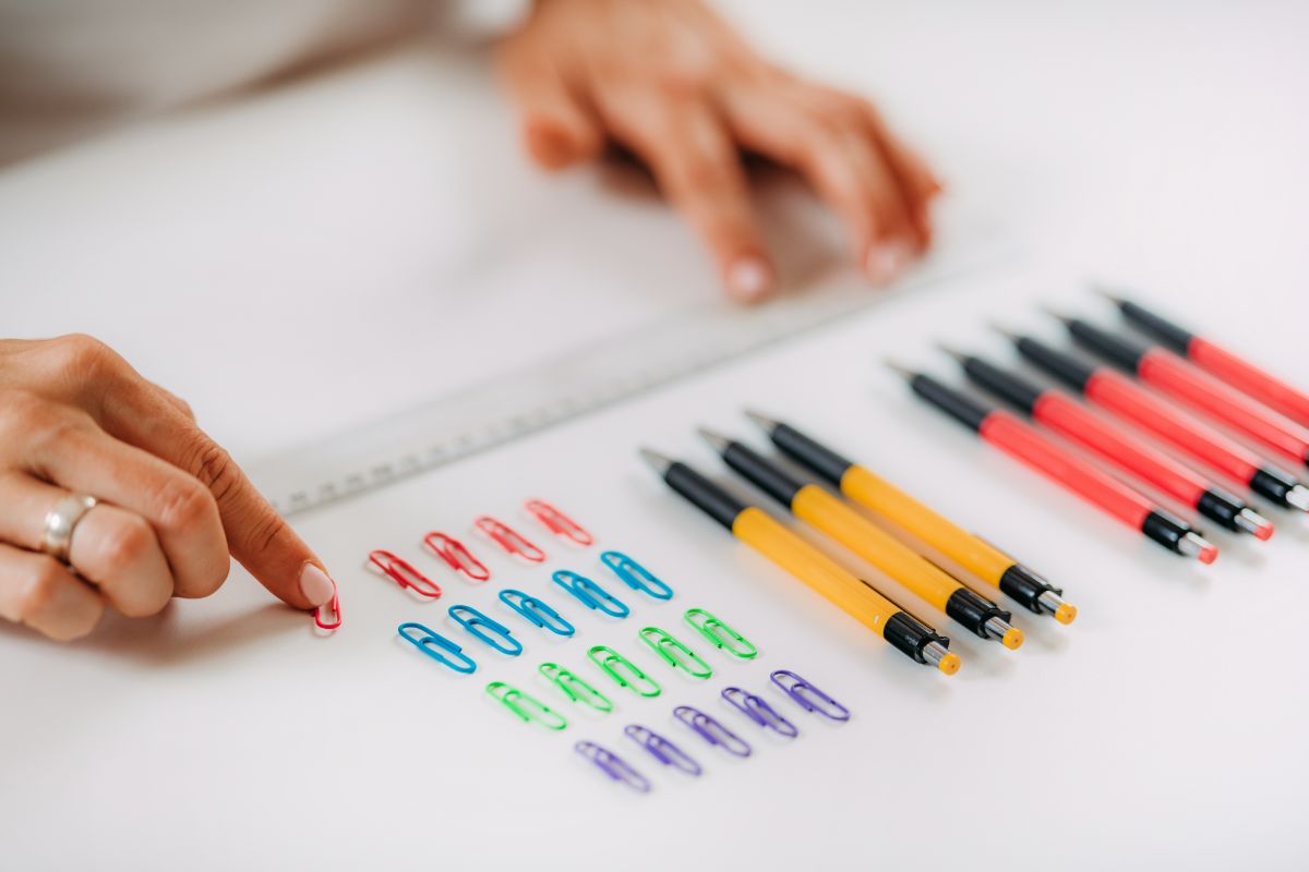 person with OCD organizes office supplies