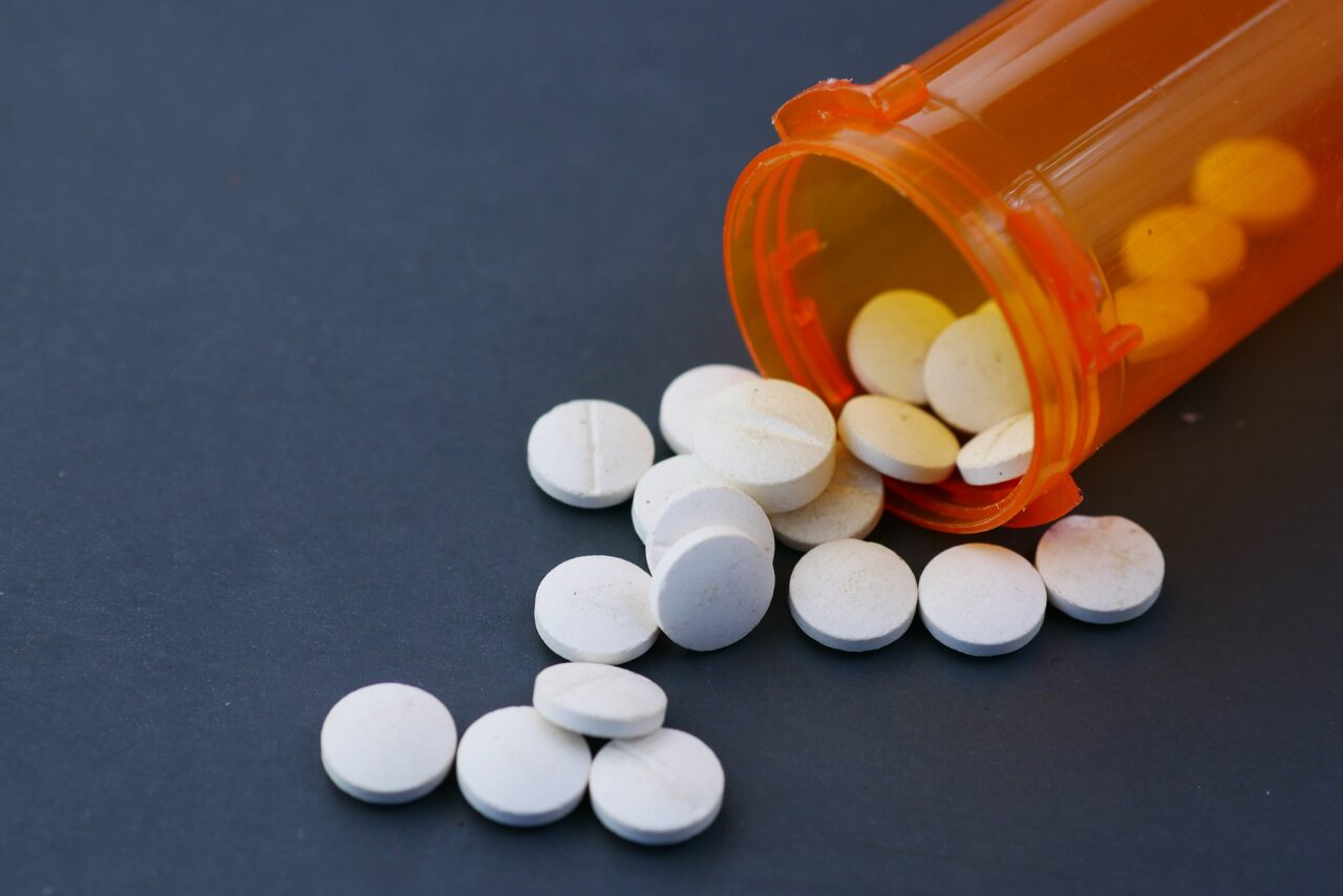 bottle of methadone spread out on a table