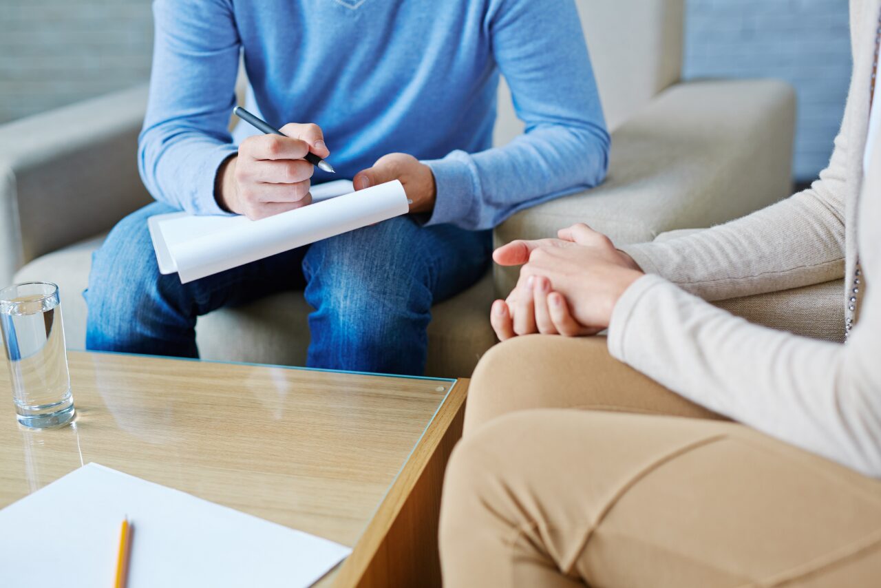 therapist speaking with her patient about the differences between php vs iop